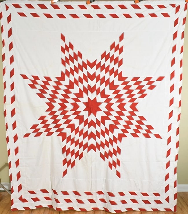 1890's Red & White Lone Star Quilt Top: This outstanding cotton 1890's red and white lone star quilt top is all machine pieced, with multiple borders. It measures 82" X 96" and is in very good, washed condition, with the occasional small, i