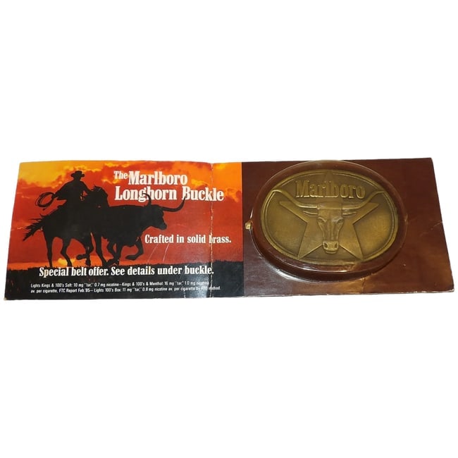 NOS Marlboro Longhorn Solid Brass Belt Buckle: This Marlboro Longhorn Solid Brass Belt Buckle comes in its original packaging. The buckle measures 3 1/4" x 2 1/2". These were given away if you purchased a carton of a certain type of cigarette.