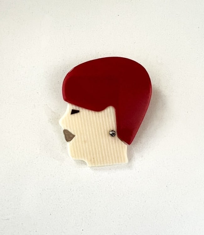 Leah Stein Marcelle Woman Face Brooch: Title: Leah Stein Marcelle Woman Face Brooch Description: A signed Lea Stein Marcelle Woman Face brooch by French designer Lea Stein who along with her husband, Fernand, developed an innovative