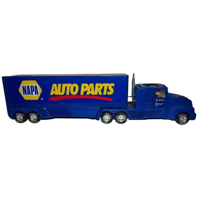 1990's Nylint Napa Auto Parts Truck and Trailer- Metal and Plastic: This Nylint Napa Auto Parts Truck and Trailer Has a metal trailer and cab other parts are plastic. The undercarriage on the tractor and trailer is metal. It is missing the top wind deflector and one