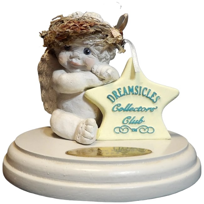 Dreamsicles Collectors Club Charter Member 1993: This Dreamsicles Collectors Club Charter Member 1993 was produced in 1991. It is in very good condition and measures 4" tall with a 5" base. Dreamsicles are porcelain figurines that are highly