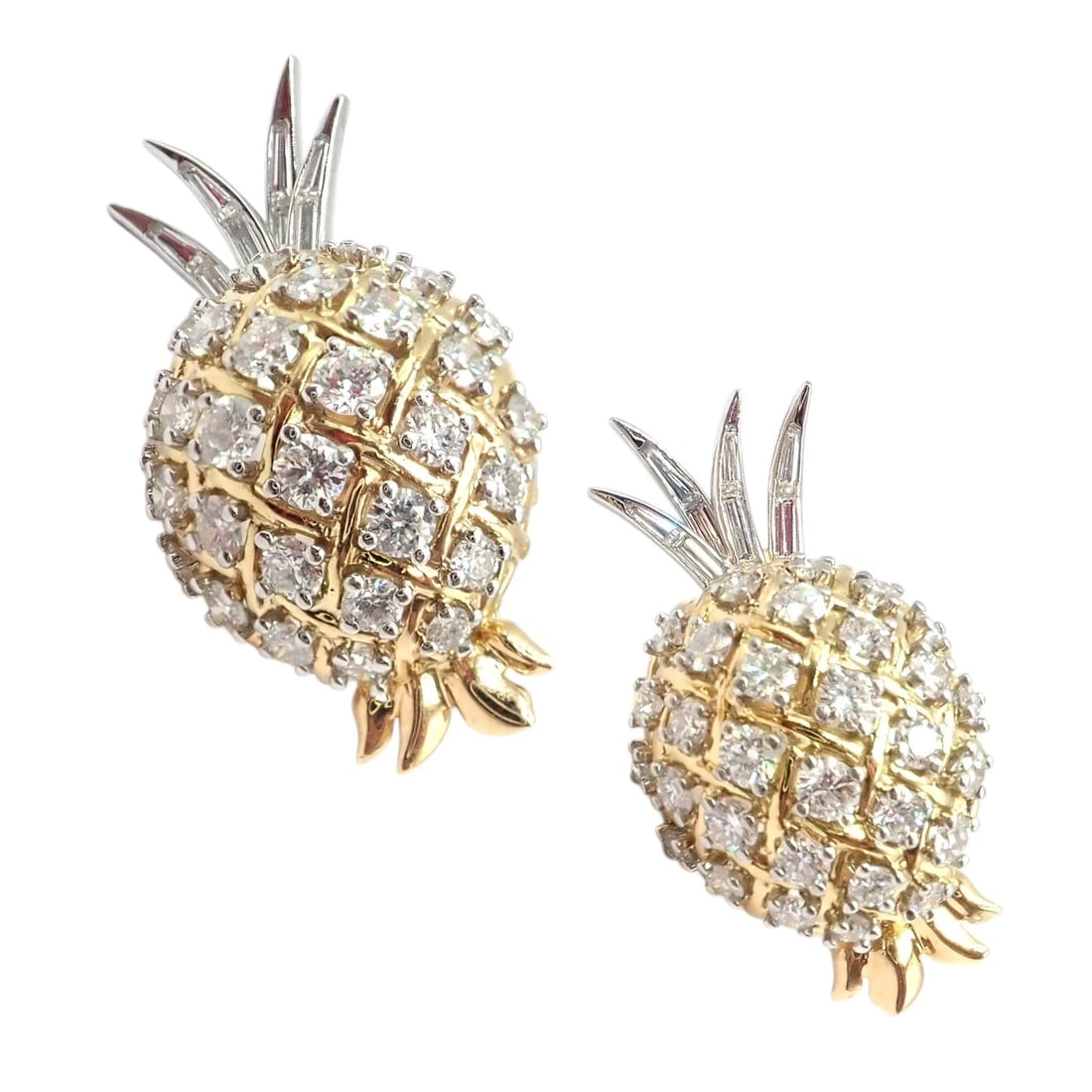 Authentic! Verdura 18k Yellow Gold Platinum Diamond Pineapple Earrings: Crafted in 18k yellow gold and platinum, Verdura’s pineapple earrings shimmer with pavé-set round and baguette diamonds. The sculptural fruit motif features a textured lattice design and