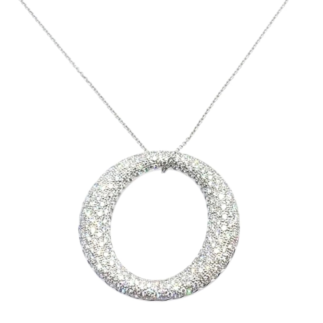 Tiffany & Co Peretti Platinum Diamond Large 35mm Sevillana Pendant Necklace: This authentic Tiffany & Co. Elsa Peretti Sevillana pendant necklace is crafted in platinum and pavé-set with brilliant diamonds. The large 35mm open-circle design offers fluid, sculptural elegan