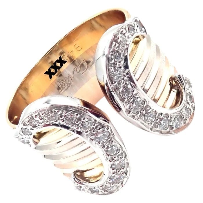 Authentic! Cartier Diamond Double C 18k Tri-Color Gold Band Ring Size 52 US 6: Authentic! Cartier Diamond Double C 18k Tri-Color Gold Band Ring Size 52 US 6 About This Piece: The Cartier Diamond Double C 18k Tri-Color Gold Band Ring features a harmonious blend of yellow, white, 