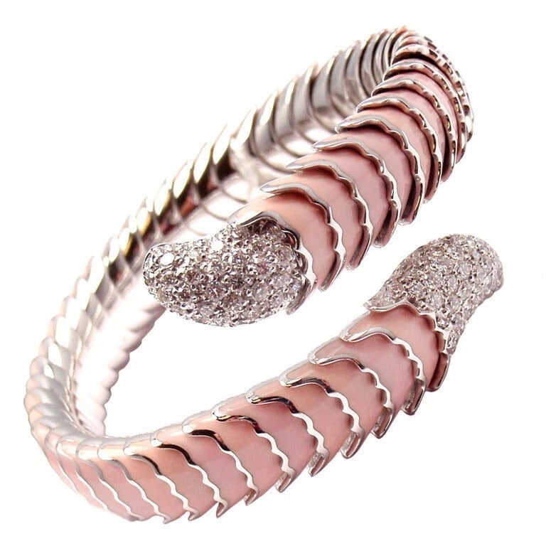 Authentic! Roberto Coin 18k White Gold Enamel Ruby Diamond Cobra Bangle Bracelet: Authentic! Roberto Coin 18k White Gold Enamel Ruby Diamond Cobra Bangle Bracelet About This Piece: About Roberto Coin: Founded in Vicenza in 1977, Roberto Coin was first established by its eponymous