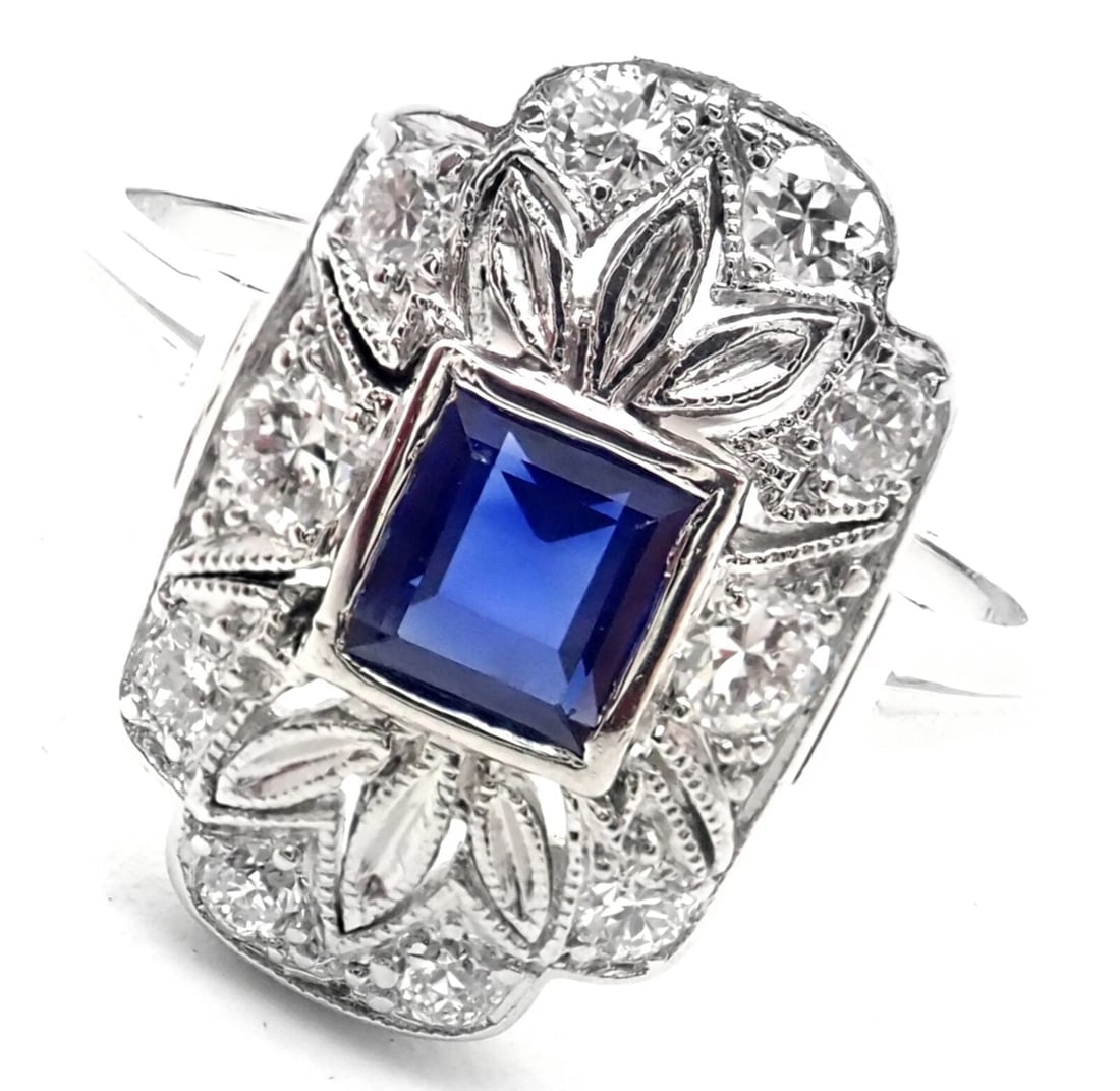 Vintage! Authentic Tiffany & Co Irid Platinum Diamond Sapphire Cocktail Ring: Vintage! Authentic Tiffany & Co Irid Platinum Diamond Sapphire Cocktail Ring About This Piece: Metal: Irid. Platinum Weight: 3.4 grams Size: 5 Stones: Sapphire - 5mm x 4mm 10 Round Brilliant Cut Diamo
