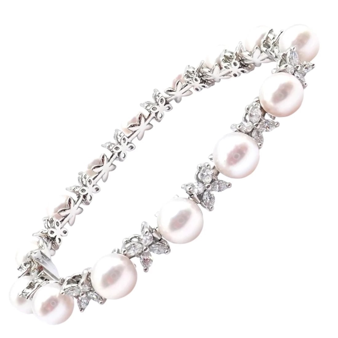 Tiffany & Co Victoria Platinum Diamond Akoya Cultured Pearl Line Tennis Bracelet: Tiffany & Co Victoria Platinum Diamond Akoya Cultured Pearl Line Tennis Bracelet About This Piece: This exquisite Tiffany & Co Victoria tennis bracelet is meticulously crafted in platinum, featuring