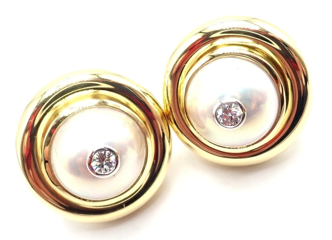 Authentic Tiffany & Co Picasso 18k Yellow Gold Diamond Mabe Pearl Earrings Paper: Authentic Tiffany & Co Picasso 18k Yellow Gold Diamond Mabe Pearl Earrings Paper About This Piece: These earrings come with Tiffany & Co replacement value from 1993, a receipt and a box. Metal: 18k