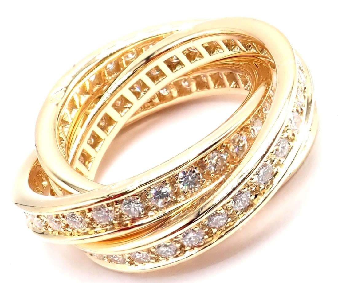 Authentic! Cartier 18k Yellow Gold Diamond Trinity Band Ring Size 5 3/4 Paper: Authentic! Cartier 18k Yellow Gold Diamond Trinity Band Ring Size 5 3/4 Paper About This Piece: The Authentic! Cartier 18k Yellow Gold Diamond Trinity Ring is a stunning piece of jewelry. Crafted