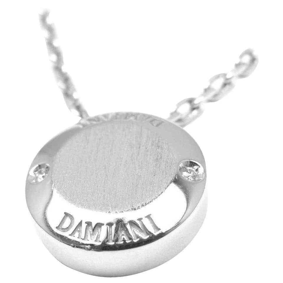 Authentic! Damiani Blasoni Diamond 18k White Gold Pendant Necklace: Authentic! Damiani Blasoni Diamond 18k White Gold Pendant Necklace About This Piece: The Authentic Damiani Blasoni Diamond 18k White Gold Pendant Necklace embodies pure sophistication. Crafted in 18k