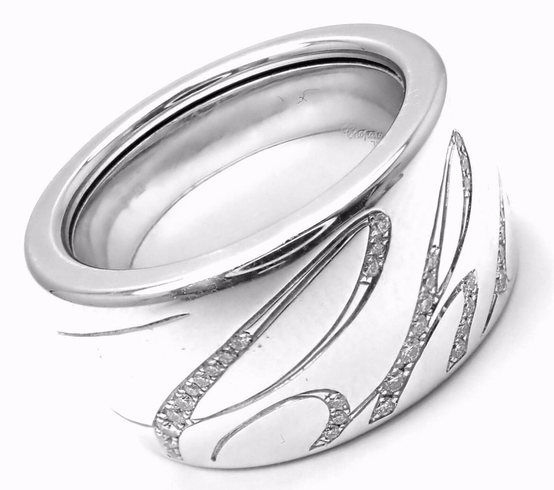 Chopard Chopardissimo 18k White Gold Diamond Signature Band Ring Size 6 Cert: Chopard Chopardissimo 18k White Gold Diamond Signature Band Ring Size 6 Cert About This Piece: This ring comes with Chopard certificate and a Chopard box. Metal: 18k White Gold Size: 6 Width: Weight: