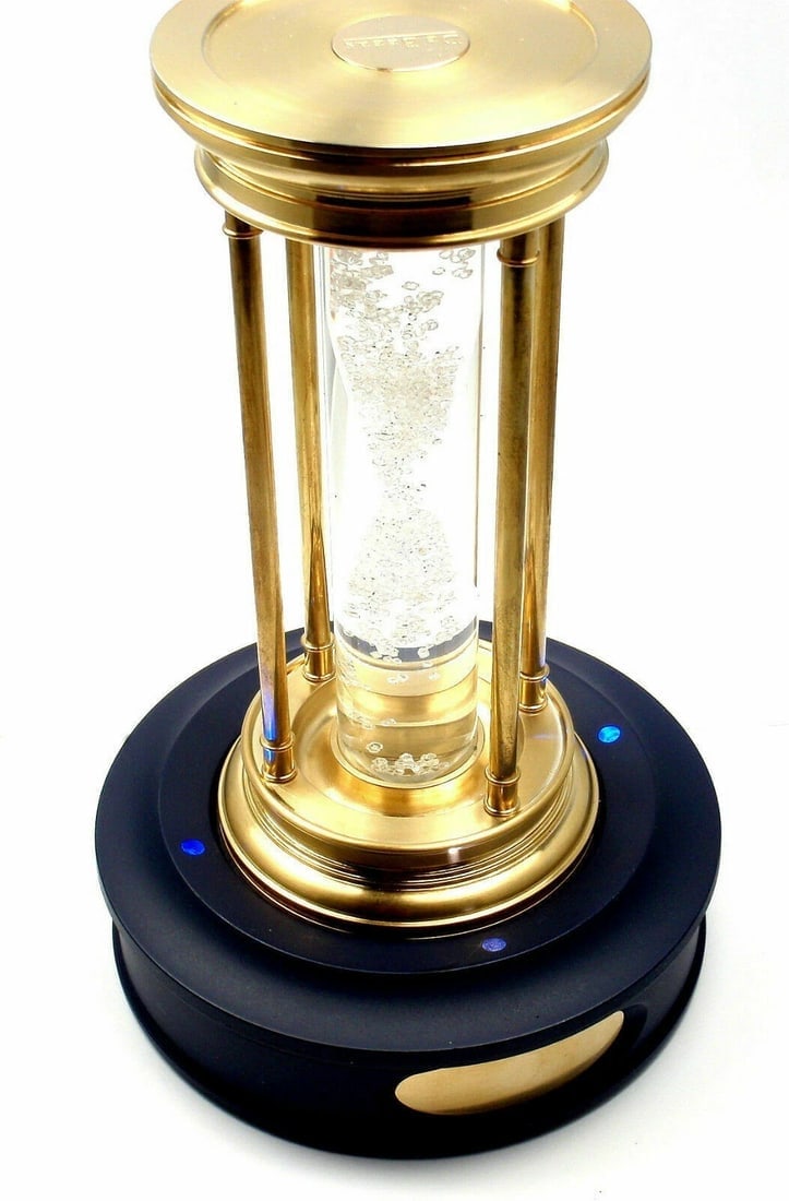 Very Rare! De Beers Limited Edition Millennium 2000 Diamond Brass Hourglass: Very Rare! De Beers Limited Edition Millennium 2000 Diamond Brass Hourglass About This Piece: This item comes with pedestal and box. Containing a cascade of over 2000 natural rough diamonds, weighing 
