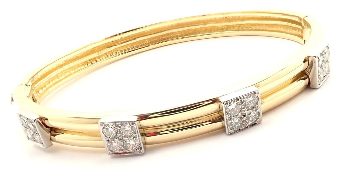Rare! Vintage Authentic Tiffany & Co 18k Yellow Gold Diamond Bangle Bracelet: Rare! Vintage Authentic Tiffany & Co 18k Yellow Gold Diamond Bangle Bracelet About This Piece: Tiffany Box + Pouch Included Metal: 18k Yellow Gold Measurements: Length: 6.5" Width: 7mm Weight: 24.6
