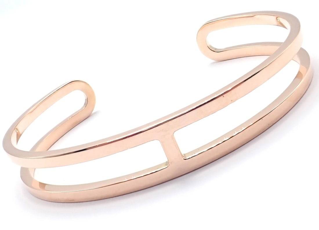 Authentic! Hermes 18k Rose Gold H Open Cuff Bangle Bracelet: Authentic! Hermes 18k Rose Gold H Open Cuff Bangle Bracelet About This Piece: Metal: 18k Rose Gold Size: ST Length: 6.46" Weight: 21.7 grams Width: 11mm Hallmarks: HERMES 750 ST Made In France