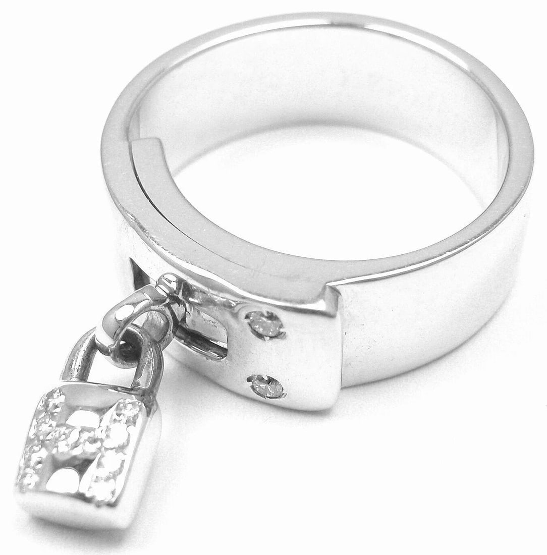 Authentic! Hermes 18k White Gold Diamond "H" Lock Band Ring Size 5: Authentic! Hermes 18k White Gold Diamond "H" Lock Band Ring Size 5 About This Piece: Metal: 18k White Gold Size: US 5 Measurements: Weight: 13.4 grams Width: 7mm Stones: 12 Round Brilliant Cut