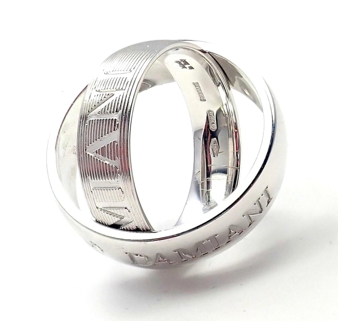 Authentic! Damiani 18k White Gold Diamond Double Band Ring Size 7 Box & Paper: Authentic! Damiani 18k White Gold Diamond Double Band Ring Size 7 Box & Paper About This Piece: Damiani Box + Paperwork included Metal: 18k White Gold Measurements: Weight: 11 grams Width: 5.5mm