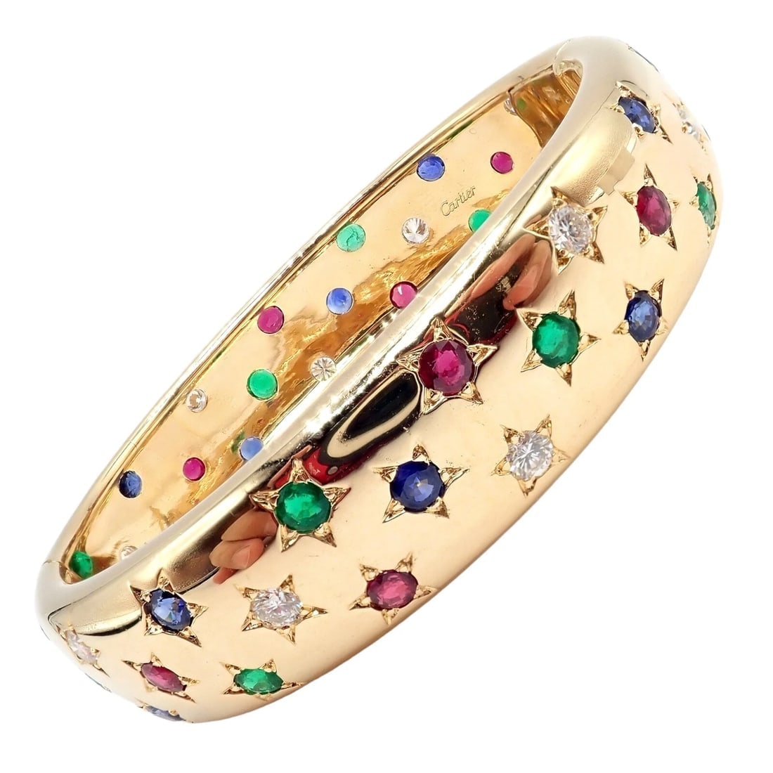 Cartier Star 18k Yellow Gold Diamond Ruby Emerald Sapphire Bangle Bracelet Cert.: Cartier Star 18k Yellow Gold Diamond Ruby Emerald Sapphire Bangle Bracelet Cert. About This Piece: The Cartier Star 18k Yellow Gold Diamond Ruby Emerald Sapphire Bangle Bracelet is an exquisite piece