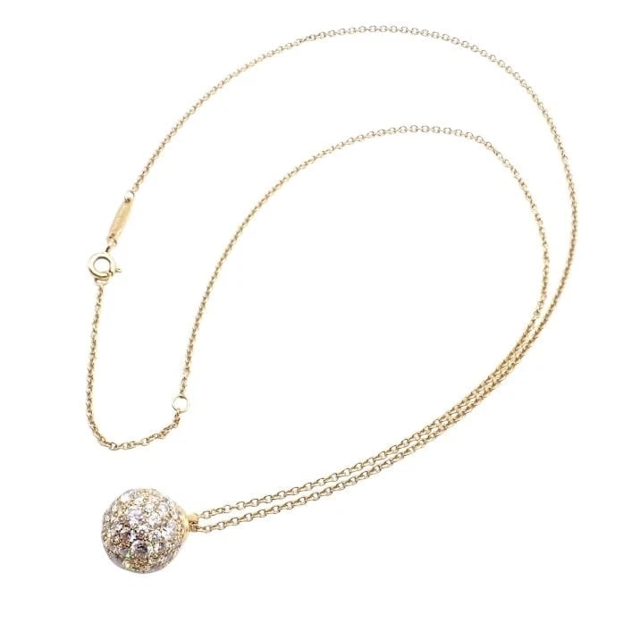 Authentic! Tiffany & Co 18k Yellow Gold Hardware Diamond Ball Pendant Necklace: Authentic! Tiffany & Co 18k Yellow Gold Hardware Diamond Ball Pendant Necklace About This Piece: This Tiffany & Co. pendant necklace showcases a dazzling diamond-encrusted ball on a delicate 18k yello