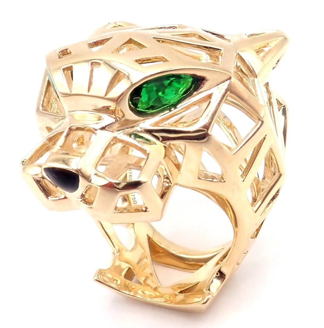 Authentic! Cartier Panther Panthere 18k Yellow Gold Tsavorite Onyx Large Ring: Authentic! Cartier Panther Panthere 18k Yellow Gold Tsavorite Onyx Large Ring About This Piece: Metal: 18k Yellow Gold Measurements: Width: 1 1/4" Weight: 23.7 grams Stones: 2 tsavorite garnets in