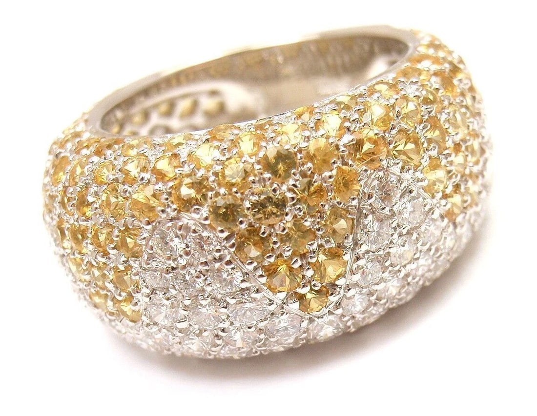 Authentic! Chopard 18k White Gold Yellow Sapphire Diamond Wave Wide Band Ring: Authentic! Chopard 18k White Gold Yellow Sapphire Diamond Wave Wide Band Ring About This Piece: Retails: $23,000 Metal: 18k White Gold Ring Size 6.25, Width: 8-11.5 mm Weight: 11.8 grams Stones: 113
