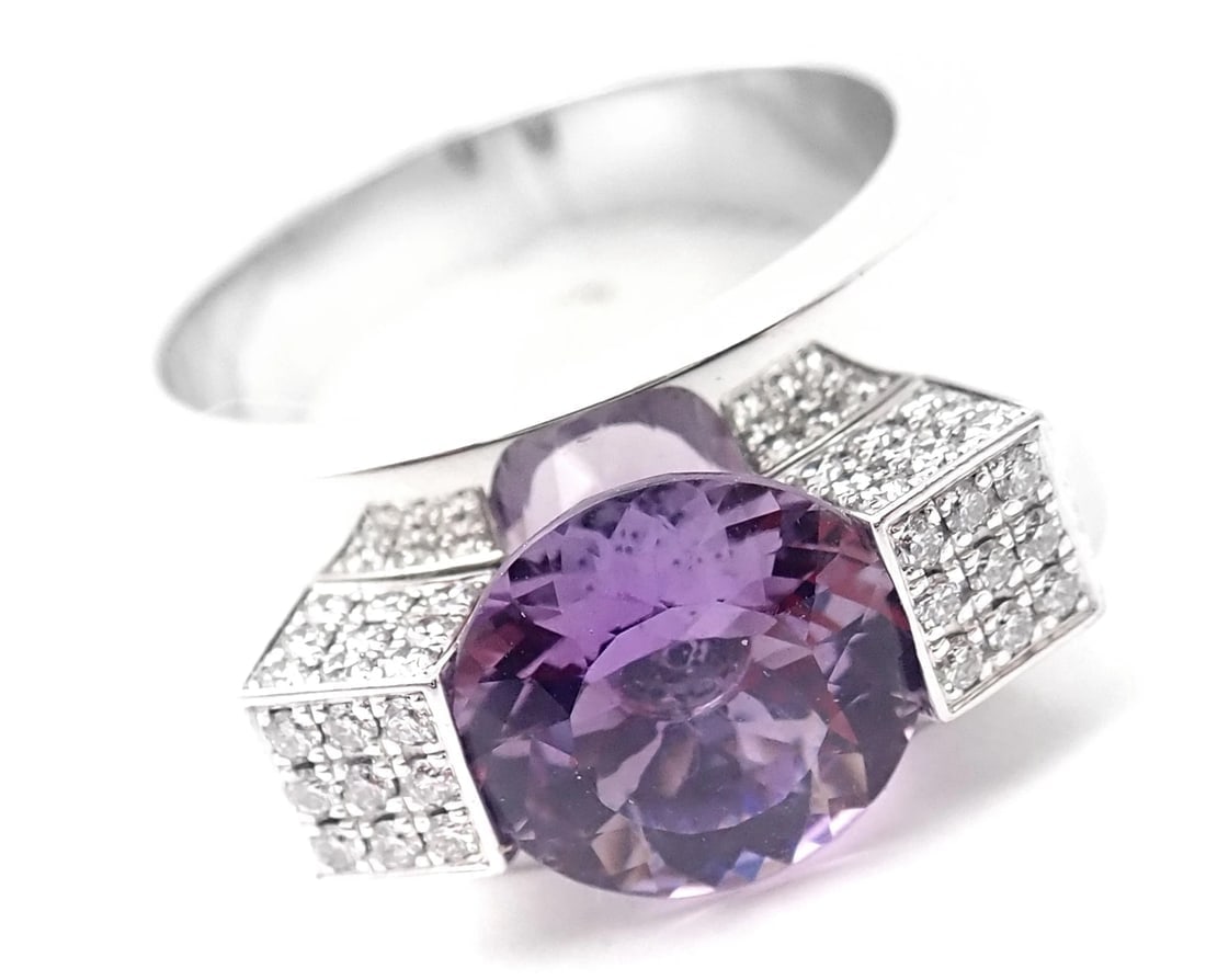 Authentic! Chopard 18k White Gold Diamond Amethyst Wide Band Ring: Authentic! Chopard 18k White Gold Diamond Amethyst Wide Band Ring About This Piece: Metal: 18k White Gold Measurements: Weight: 18.6 grams Width: 10.5mm Size: 7 Stones: 72 round brilliant cut