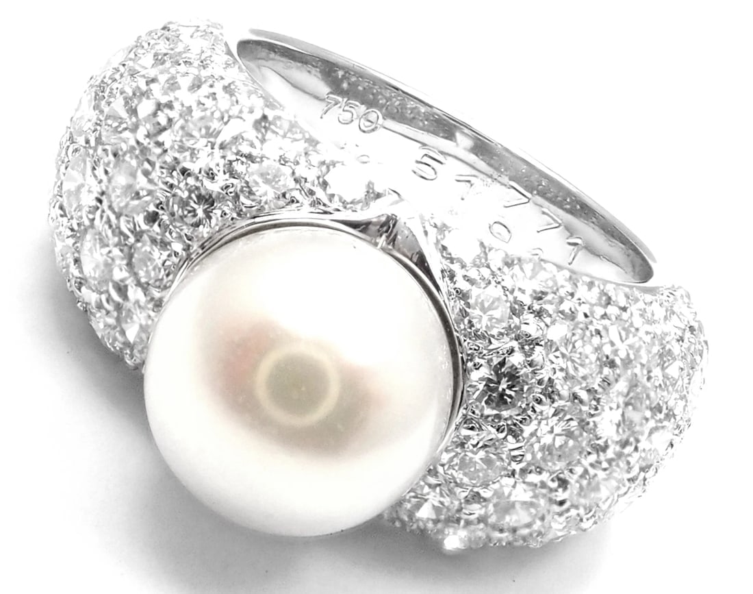 Authentic! Cartier Juliette 18k White Gold Cultured Pearl Diamond Band Ring: Authentic! Cartier Juliette 18k White Gold Cultured Pearl Diamond Band Ring About This Piece: This ring comes with original Cartier box. Metal: 18k White Gold Measurements: Width: 11mm Weight: 10.3