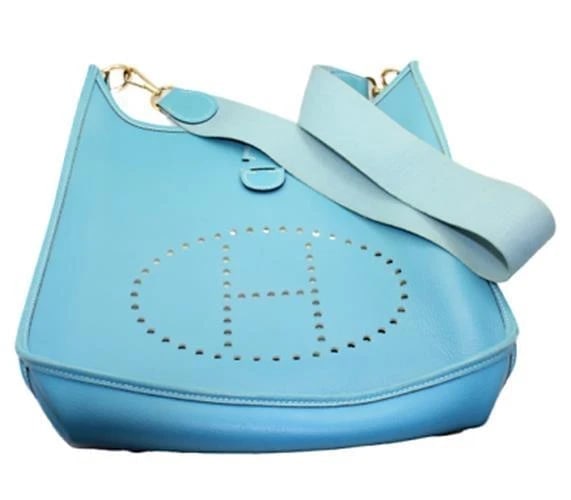 Authentic! Hermes Evelyne Blue Jean Clemence Leather GM Handbag Purse: Authentic! Hermes Evelyne Blue Jean Clemence Leather GM Handbag Purse About This Piece: Bag Hermes Evelyne Size: 13 inches x 12.75 inches x 3 inches Strap: 18" strap drop ALL MEASURES ARE APPROXIMATE