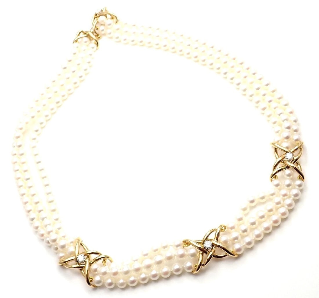 Authentic! Tiffany & Co 18k Yellow Gold Diamond 3 Strand Pearl Necklace: Authentic! Tiffany & Co 18k Yellow Gold Diamond 3 Strand Pearl Necklace About This Piece: Metal: 18k Yellow Gold Length: Width: 16" 5mm Weight: 50.5 grams Stones: 4 round brilliant cut diamonds VS1