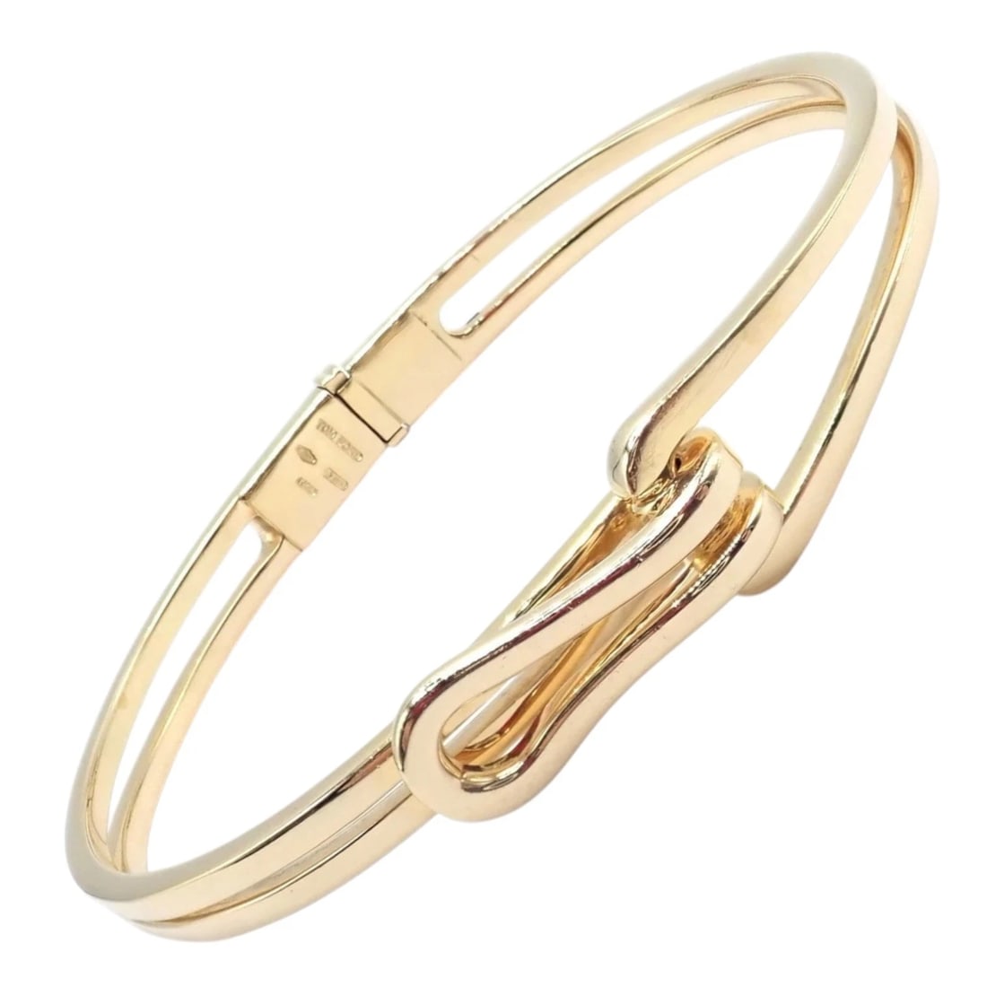 Rare! Authentic! Tom Ford 18k Yellow Gold Bangle Bracelet: Sleek and modern, this Tom Ford bangle is crafted in luminous 18k yellow gold. The fluid, sculptural design features a polished looped motif at the center, evoking understated sensuality. Finished