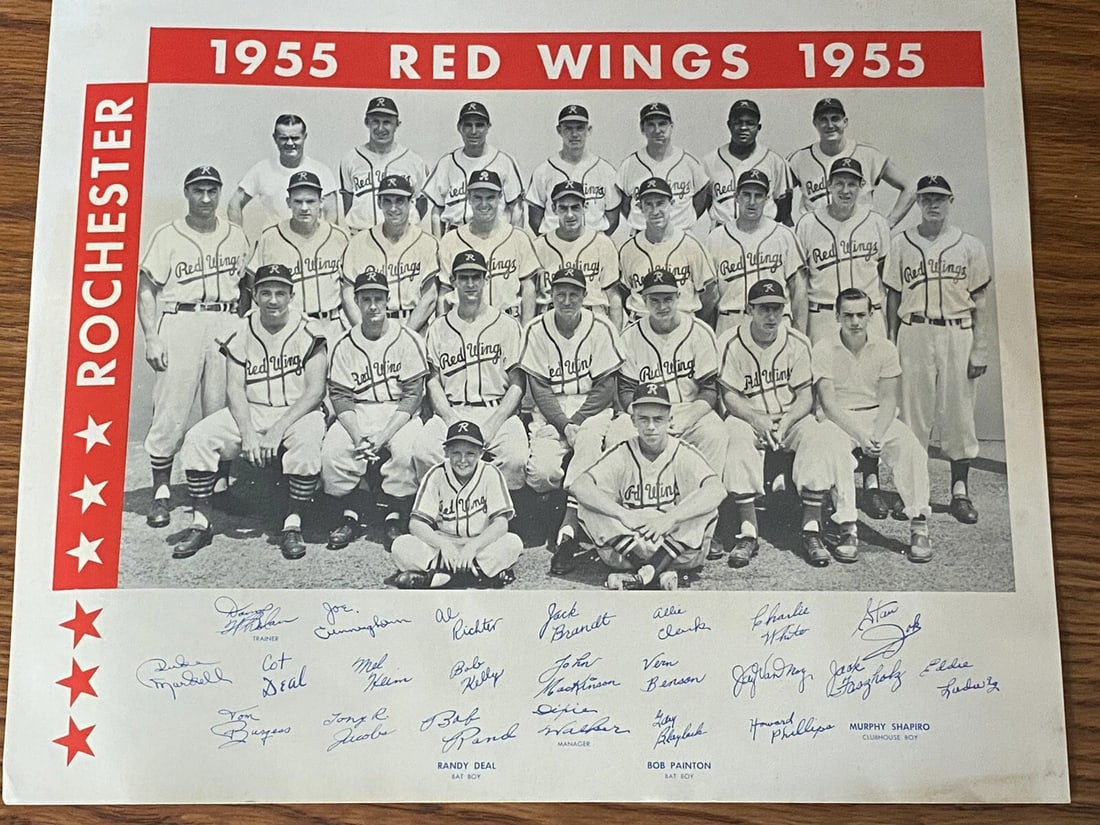 1955 Rochester Red Wings International League Baseball Team Photo NRMT: 1955 Rochester Red Wings International League Baseball Team Photo NRMT. 8 1/4” x10”. Lower 2/3 a bit yellowed from age, some discoloration along bottom edge. Shipped with USPS First Class.
