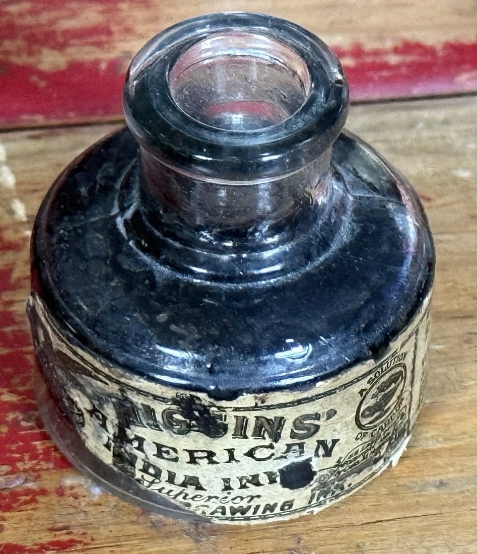 Antique Hand Blown Higgins American India Ink Brooklyn NY Labeled #32 Label: The product is an antique hand-blown Higgins American India ink bottle from Brooklyn, NY, with a good portion of the label intact, with raised bottom lettering showing the ink contained is # 32. This 