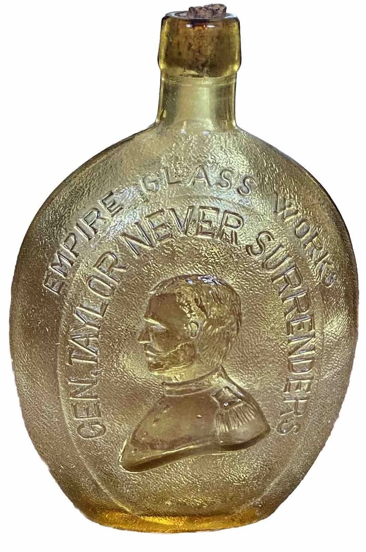 Empire Glass Works Washington General Taylor Amber Embossed Bottle Flask W/Cork: This vintage amber colored bottle/flask from Empire Glass Works is a must-have for any collector or enthusiast. The intricate embossed designs features a depiction of George Washington on one side and