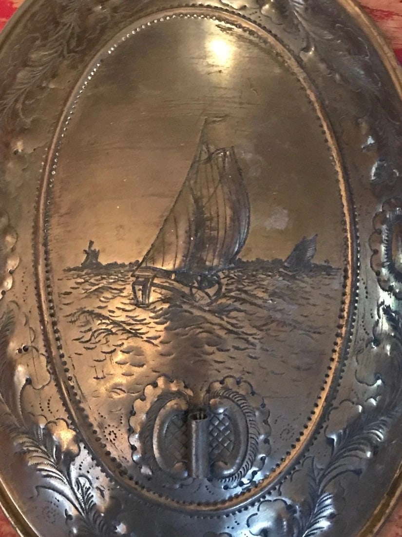 Antique Dutch Wall Sconce Hammered Sailboat Scene Floral Border P&SDykstra Sneek: Up for sale is an antique Dutch wall sconce with maker's mark stamped on back. It has a very scene of sailboats on the water in the center with an oval border. The scene is bordered by a floral design
