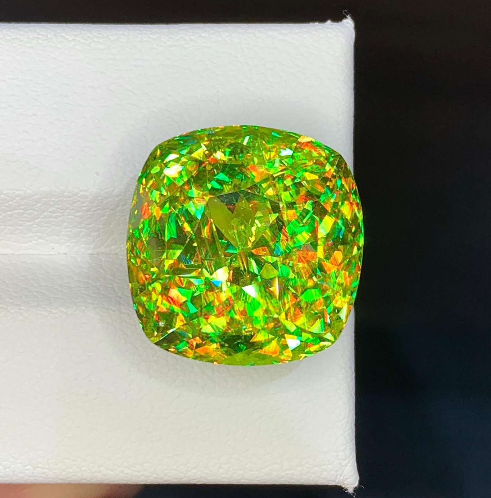 Natural Madagascar Sphene (Titanite) 26.29 Carat - Cushion Cut Rainbow Fire Loose Gemstone: Bring extraordinary brilliance to your gemstone collection with this Natural Madagascar Sphene (Titanite) weighing 26.29 carats. Expertly precision cut into a striking rectangular fancy cut, this exce