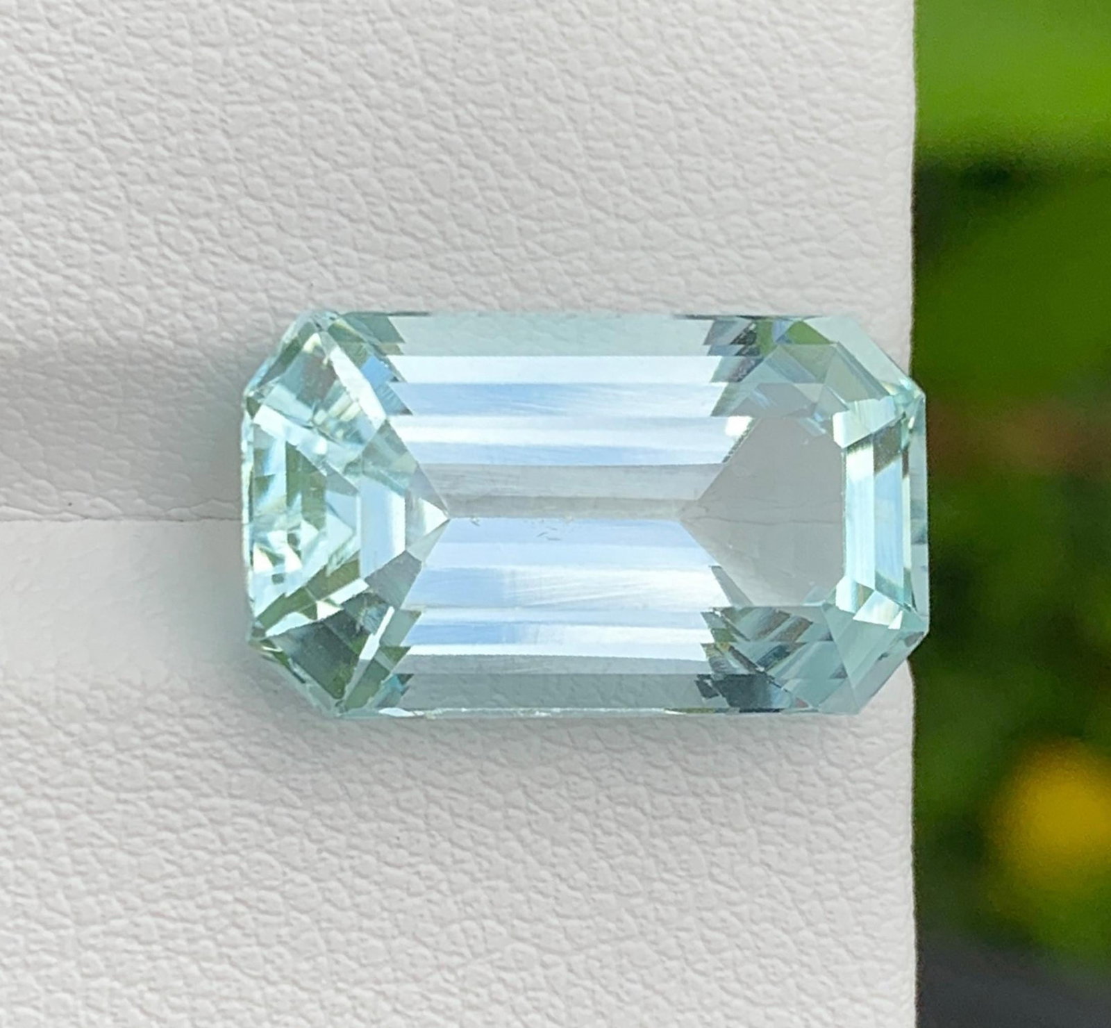 Natural Pakistan Aquamarine Gemstone 11.90 Carat Emerald Cut - Loose Sky Blue Aquamarine for Ring: Discover the breathtaking beauty of this Natural Pakistan Aquamarine weighing an impressive 11.90 carats. Expertly fashioned in an elegant Emerald Cut, this gemstone showcases a captivating sky-blue c