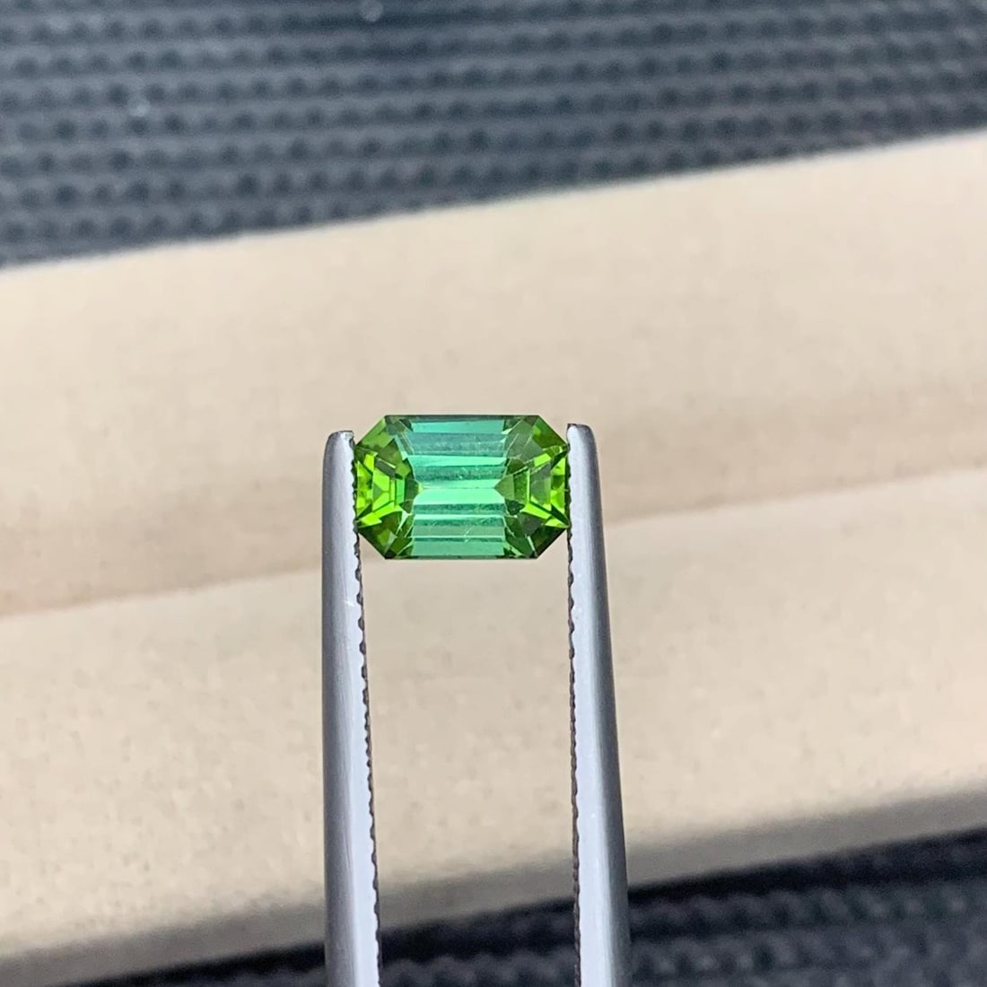 Lime Green Tourmaline Gemstone: 1.40 Carat Emerald Cut Loose Stone: Weight : 1.40 CT Dimensions : 7.8*5.2*4.4 MM Shape : Emerald Cut Clarity : Eye Clean Color : Lime Green Treatment : None Origin : Afghanistan Hardness : 7.5-8 Family : Elbaite SKU : NAZ Reserve:
