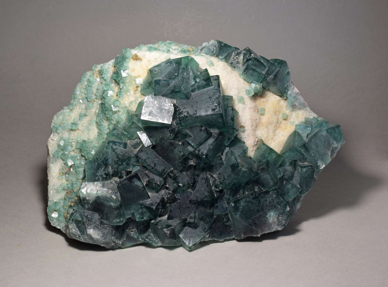 Large fluorite on matrix: Title: Large fluorite on matrix Origin: Madagascar Size: 24 x 15 x 6 cm Description: Beautiful fluorite with large, deep green crystals. The color changes to purplish-blue under UV or sunlight (see