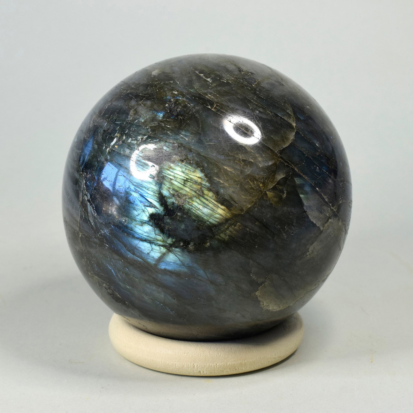 8.0 cm Polished Labradorite sphere: Title: 8.0 cm Polished Labradorite sphere Origin: Madagascar Size: 8.0 cm diameter Description: Species: Labradorite Locality: Madagascar Diameter: 8.0 cm Weight: 0.72 kg Fine polished labradorite