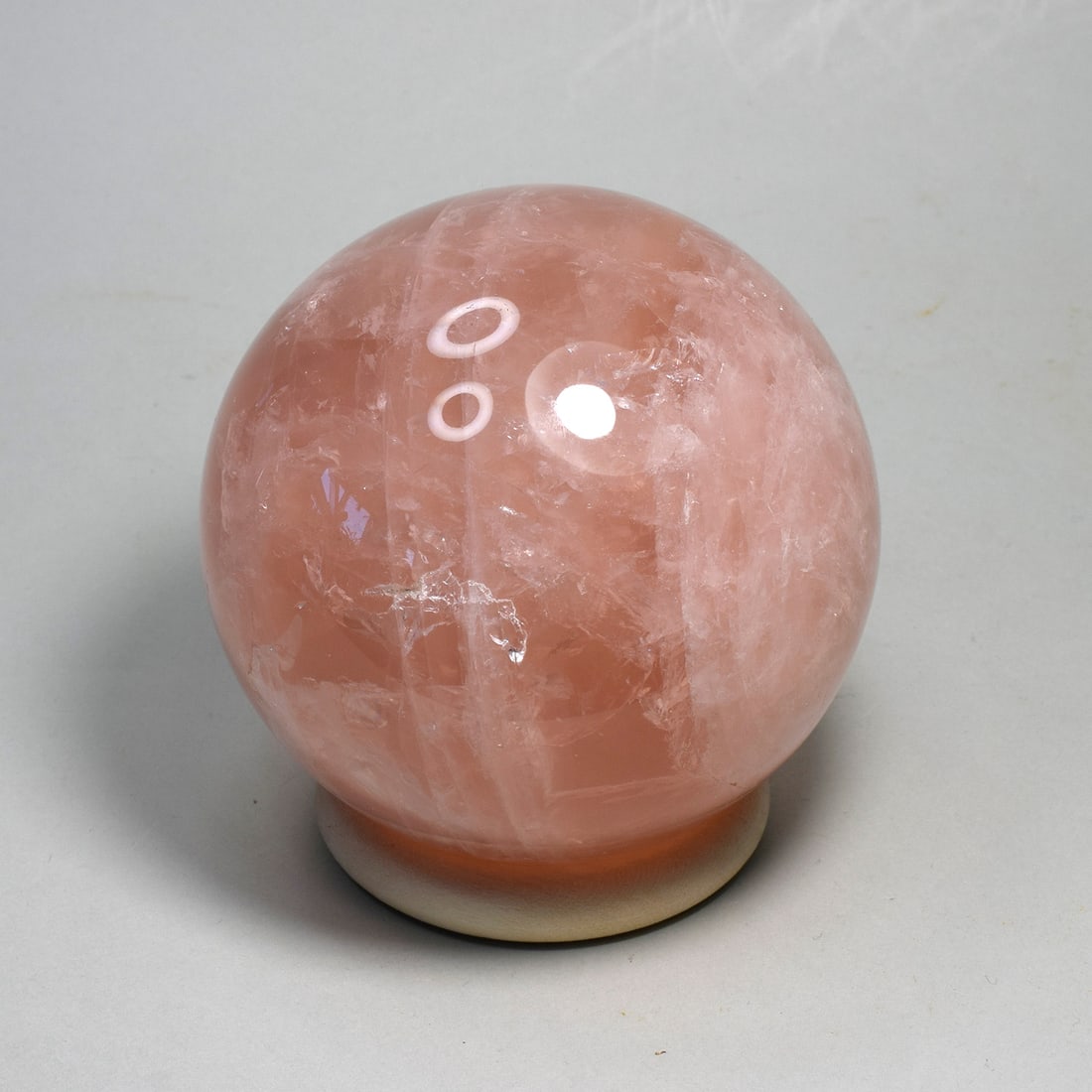 8.1 cm Rose Quartz sphere with asterism: Title: 8.1 cm Rose Quartz sphere with asterism Origin: Madagascar Size: 8.1 cm diameter Description: Species: Rose quartz Locality: Madagascar Diameter: 8.1 cm Weight: 0.73 kg Fine polished rose