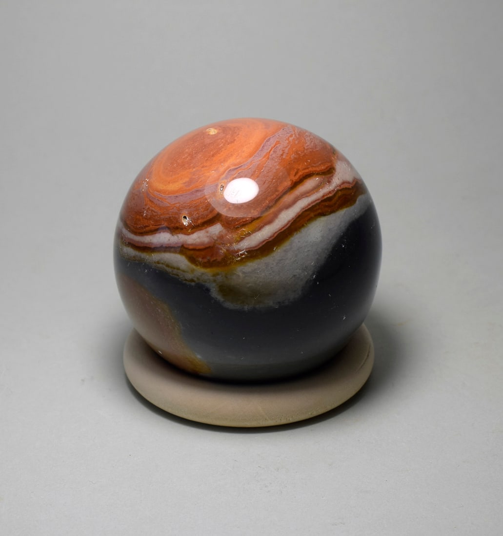 5.9 cm Polished Polychrome Jasper sphere: Title: 5.9 cm Polished Polychrome Jasper sphere Origin: Madagascar Size: 5.9 cm diameter Description: Species: Polychrome Jasper Locality: Madagascar Diameter: 5.9 cm Weight: 0.27 kg Fine polished