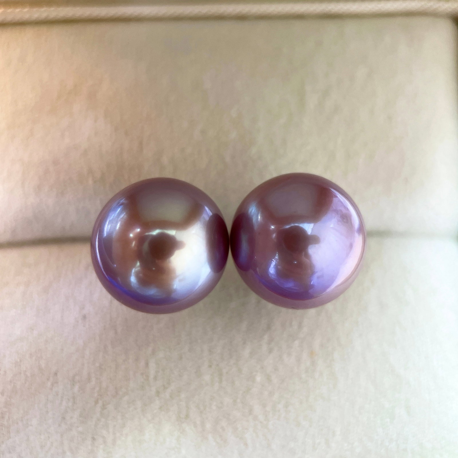 Natural Purple Edison Pearl Earrings: Title: Natural Purple Edison Pearl Earrings Description: These earrings feature natural purple Edison pearls with an exceptionally strong luster. The pearls measure between 12 to 13mm in diameter,