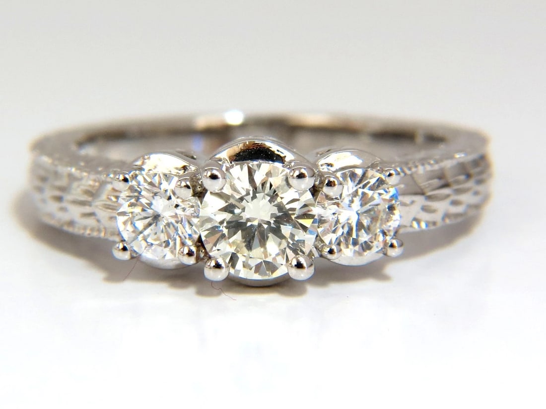 1.09CT NATURAL ROUND BRILLIANT DIAMOND RING CLASSIC THREE ENGAGEMENT: Classic Three stone & Edwardian Gilt wreath deco. .58ct. Center Round Brilliant natural diamond. & .51ct (2) Side natural diamonds. I-color vs-2 clarity Very good Cut 14kt white gold 4.7 grams Ring