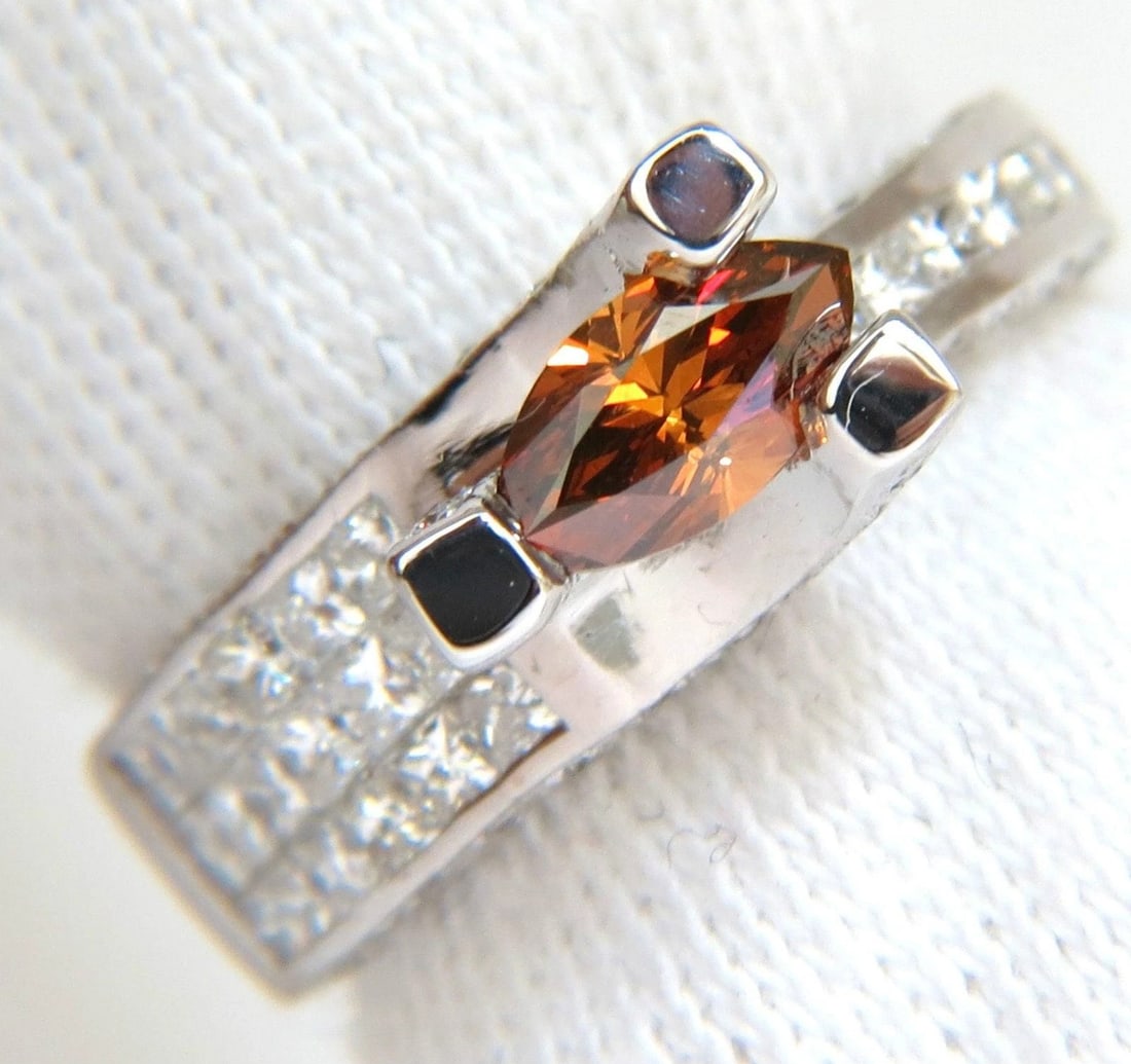 GIA NATURAL FANCY ORANGE BROWN 2.05CT DIAMOND RING 14KT TENSION FLOAT 10064: Title: GIA NATURAL FANCY ORANGE BROWN 2.05CT DIAMOND RING 14KT TENSION FLOAT 10064 $3,950.00 PRODUCT DESCRIPTION The Tension Float. GIA Natural .55ct. "Brown Orange". 7.71 X 4.03 X 2.75mm Vibrant