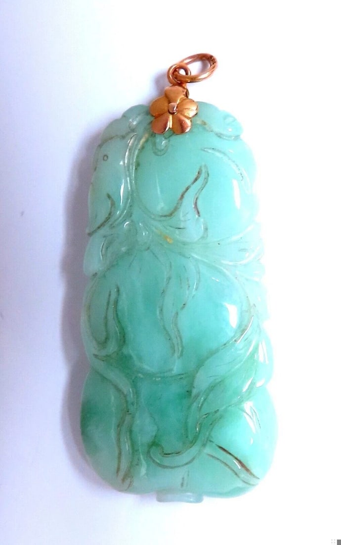 Natural Jade Carved Pendant 14kt symbol: Title: Natural Jade Carved Pendant 14kt symbol $500.00 PRODUCT DESCRIPTION Jade Pendant Apple Green color. 47 x 22mm 14kt / 15 grams Reserve: $460.00 Shipping: Domestic: Free shipping to anywhere