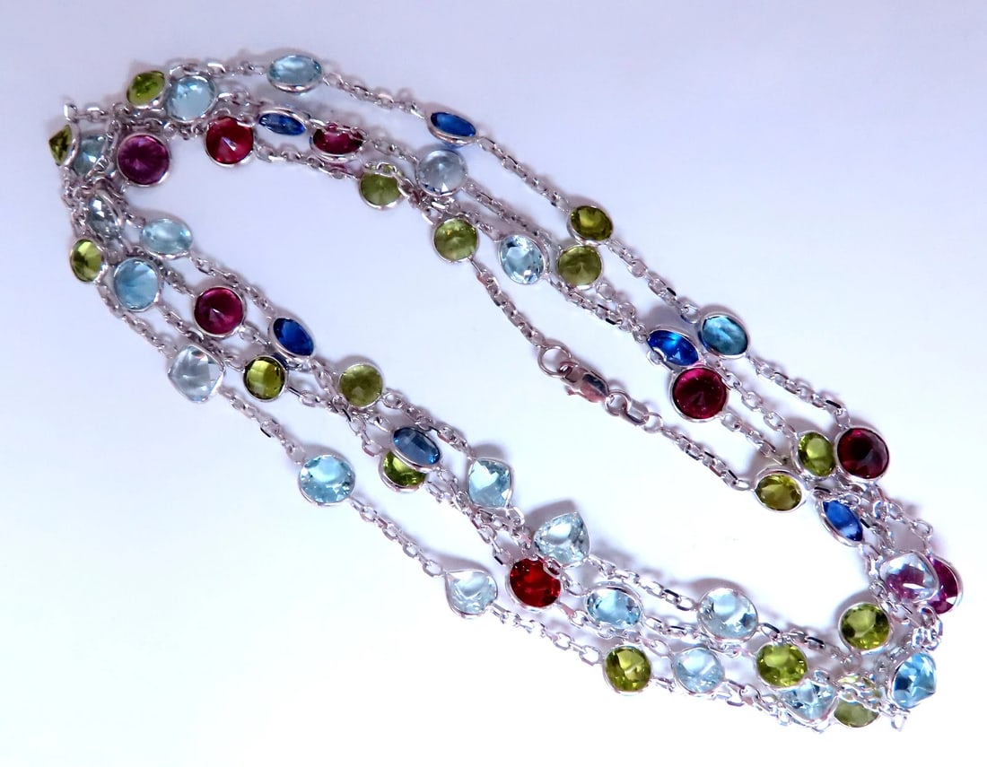 80ct Natural Aquamarine Peridot Garnet Tourmaline Necklace 14kt 12520: Title: 80ct Natural Aquamarine Peridot Garnet Tourmaline Necklace 14kt 12520 $3,600.00 PRODUCT DESCRIPTION gorgeous gem line double wrap round oval and cushion cuts natural aquamarines pendant