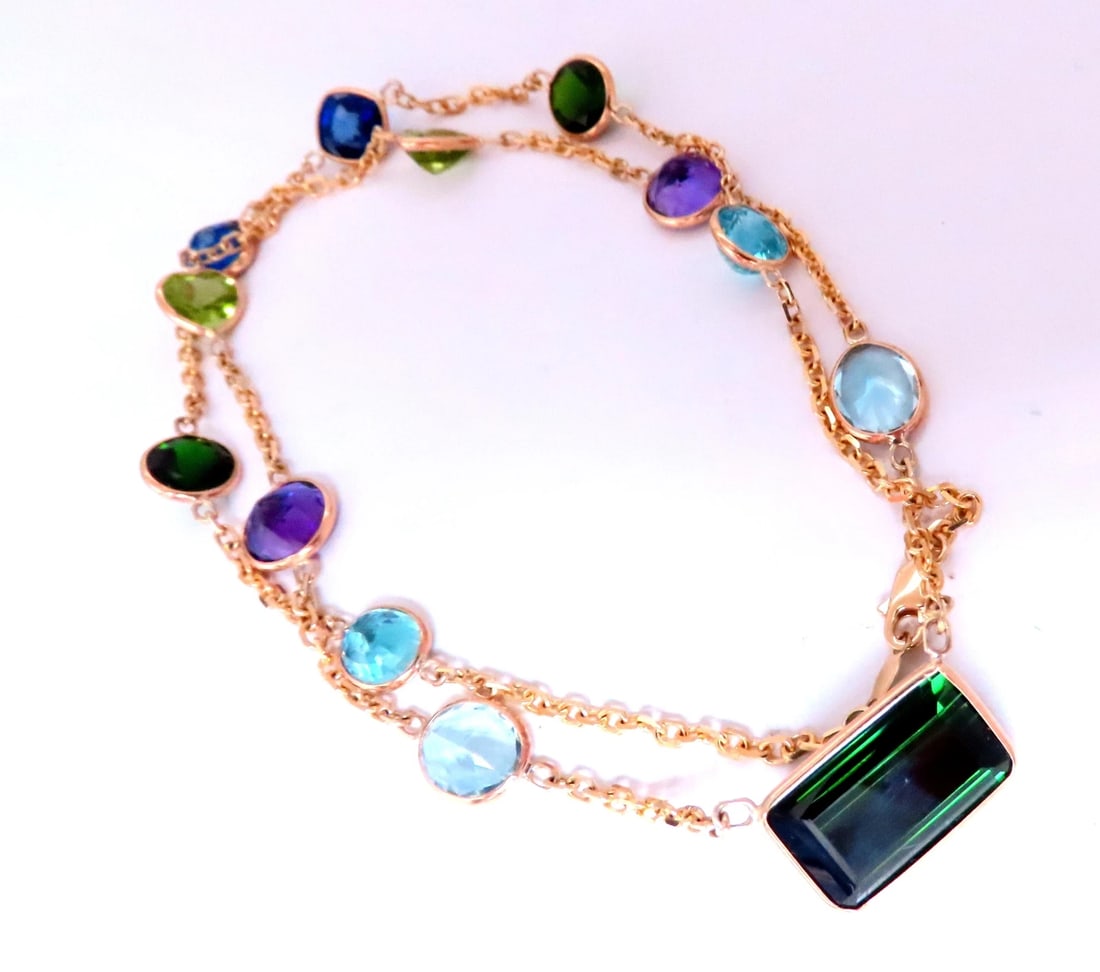56ct Natural Tourmaline Amethyst Peridot Station Yard Necklace 14kt 12521: Title: 56ct Natural Tourmaline Amethyst Peridot Station Yard Necklace 14kt 12521 $4,000.00 PRODUCT DESCRIPTION 56ct of gorgeous natural gems on chain 10ct center emerald cut green tourmaline 15 x 9mm