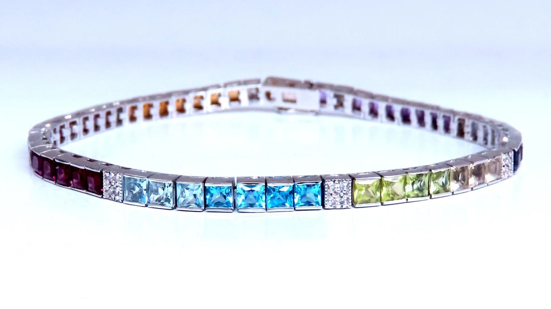 7ct semi-precious stones bracelet 14kt 12469: Title: 7ct semi-precious stones bracelet 14kt 12469 $1,800.00 PRODUCT DESCRIPTION Amethyst, garnet, citrine topaz tanzanite bracelet princess cut clean clarity 0.30ct diamonds H/vs-2 14kt whi