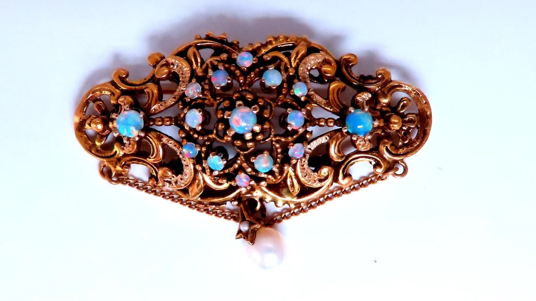 Vintage Edwardian Natural Opal Pin 14kt Pendant 12368: Title: Vintage Edwardian Natural Opal Pin 14kt Pendant 12368 $1,200.00 PRODUCT DESCRIPTION Vintage Opal Pin 1.20ct natural opals Dangling Pearl 6 x 5mm 14kt yellow gold 12.9 grams 48 x 22mm