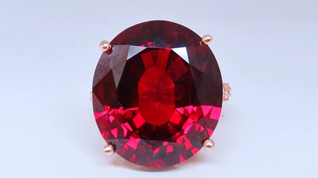 Natural 35.75 Carat Vivid Red Spessartite Diamond Ring 14kt: 32.75ct. Natural Spessartite Garnet diamond ring. 21.50 X 19mm- Natural Diamonds encrusted throughout in French pave style setting- all done by hand! F-G color, Vs-2 clarity. 14kt. yellow gold & 12.6 