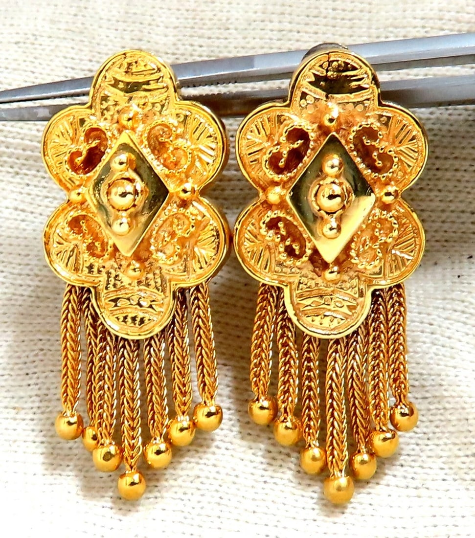 Retro Tribal Elongated Clover Tassel Dangle Earrings 14kt: Retro Tribal Clover Dangle Hoop Earrings Measurements of Earrings: 15.6mm wide. 1.4 inch long 13.7 grams / 14kt. yellow gold Comfortable Clip and post. Earrings are gorgeous made Reserve: $1,748.00